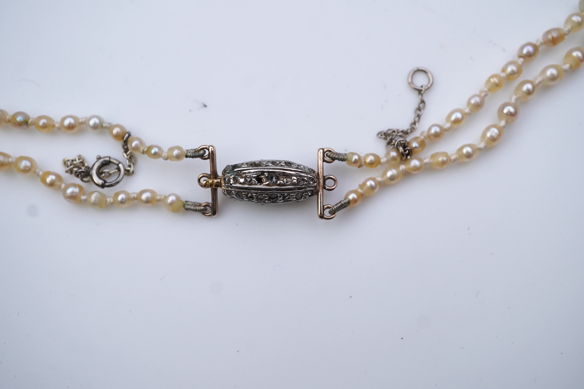 A natural pearl and diamond necklace, early 20th century